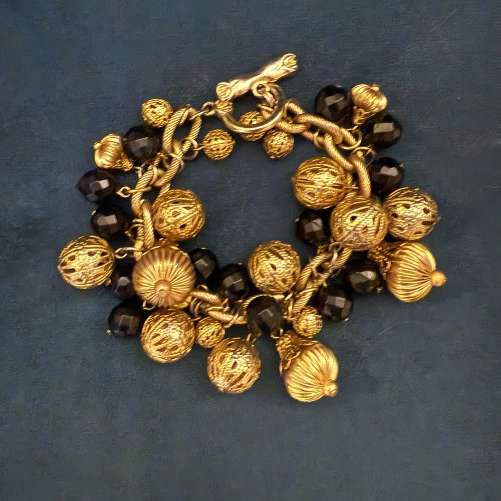 Elegant Gold and Black Charm Bracelet